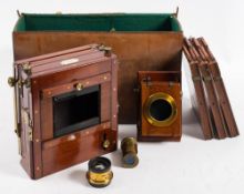 A mahogany and brass three quarter plate camera by W Waston & Son, London,