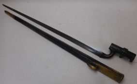 An 1876 pattern Martini Henry socket bayonet: with 55cm triangular blade, W/D arrow and date 12/87,