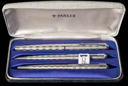 A Parker 45 trio in Harelquin Grey Shield: comprising a fountain pen,