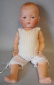 An Armand Marseille bisque head doll: impressed A.M.