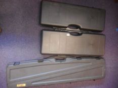 Three assorted plastic gun cases: with foam lined interiors.