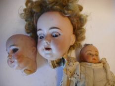 A damaged Armand Marseille bisque head doll: impressed A.M. 11 DEP.