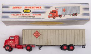 Dinky 948 Tractor Trailer 'McLean': in red and silver with black treaded tyres, in original box.