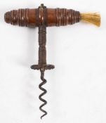 A 19th century rosewood handled corkscrew: the turned handle with brush over shaft with fluted