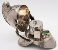 An early 20th century Merryweather pattern auxiliary fire helmet converted as a smokers companion: