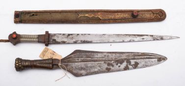 A 19th century Turkish dagger: the tapering triangular blade over a cast iron hilt and wire bound