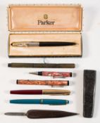 A Parker 51 fountain pen: black/silver, together with a maroon Parker pen,