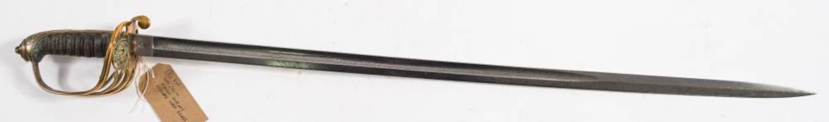 A Victorian Officers Dress sword: the single edged blade with traces of acid etched decoration