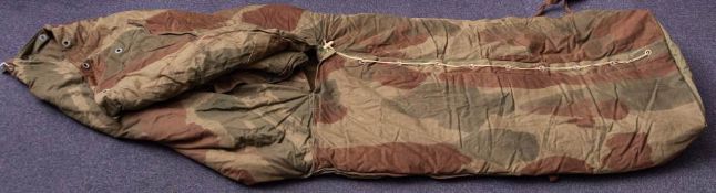 A WWII period Dennison sleeping bag by Whitleys: dated 1945, in dark green and brown camouflage,