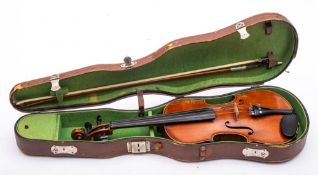 An early 20th century unnamed German violin: scroll carved headstock with ebony keys,