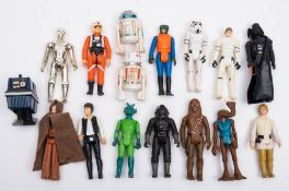 A group of vintage Star Wars figures.