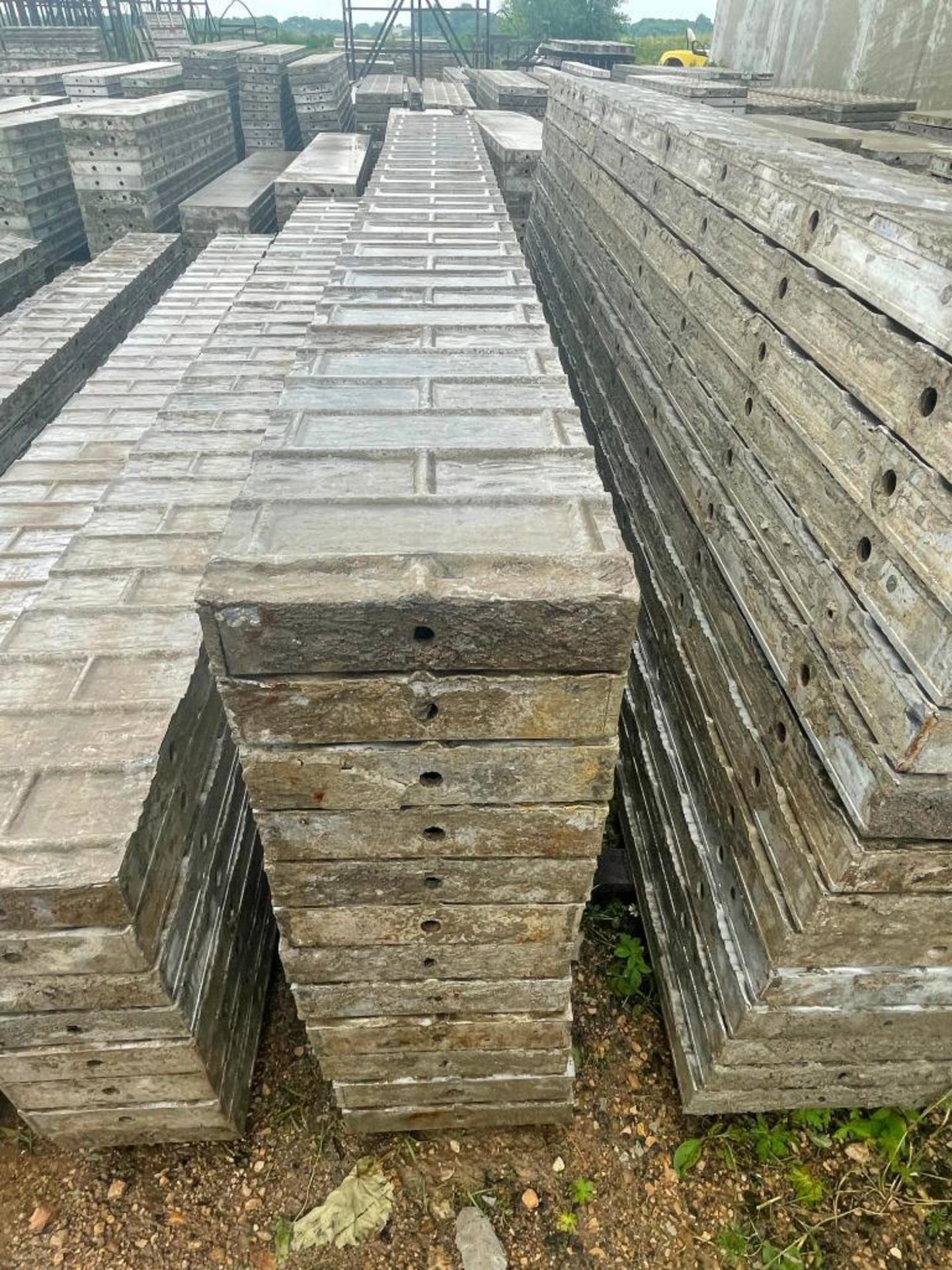 (12) 10" x 9' Wall-Ties Textured Brick Aluminum Concrete Forms 6-12 Hole Pattern. Located in Lake Cr