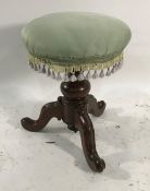 19th century circular stool on baluster turned support to three cabriole legs