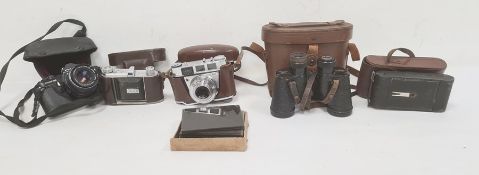 Pentax ME Super camera with 1:1.750mm lens, a Kodak Retinette camera, another Kodak camera, a pair