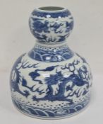 Chinese porcelain double-gourd vase with broad flat base and underglaze blue decoration of dragons