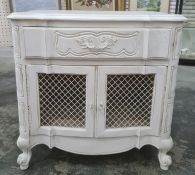 20th century white painted cupboard, the shaped top above single drawer, two grilled cupboard doors,