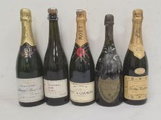 Bottle of Gallimard Champagne, bottle of Moet & Chandon, bottle of Nicolas Feuillatte and two