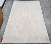Modern cream ground rug with stylised rectangular design, 238 x 156cm Condition ReportThere are