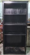 Dark stained open bookcase with fluted decoration to pillasters, on plinth base, 97.5cm x 208cm