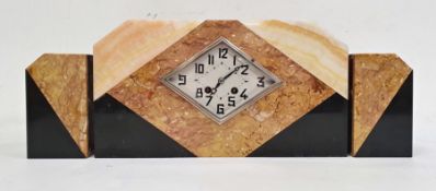 Art Deco style clock garniture in polished hardstone, the diamond-shaped dial with Arabic numerals