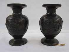 Pair of Japanese Meiji period Yoshida made bronze vases, ovoid bodies embossed in high relief with