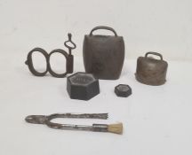 Pair of antique wrought iron hinged handcuffs with key, a steel pair of combination pliers with