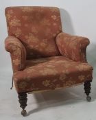 19th century armchair in foliate upholstery, on turned supports to castors  Condition ReportThe