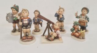 Seven various Hummel figures including boy with telescope, boy with letters and boy with turnips and