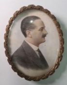 Early 20th century school Watercolour miniature Head and shoulders portrait of a gentleman in a
