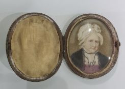 19th century school  Watercolour miniature on ivory  Head and shoulders portrait of a lady in