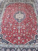 Persian Kashan carpet, the red ground field with stepped central medallion, the field decorated