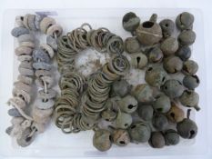Quantity of medieval lead spindle-whorles, bronze crottle bells and rings