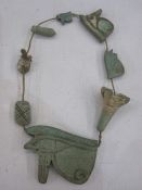 Egyptian faience amulets representing eye of Horus, lotus blossom and others, 26th Dynasty, the