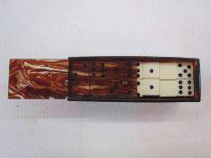 Miniature set of 'Dominos de Poche' in faux ivory and phenolic, in a faux tortoiseshell box, c. 1920