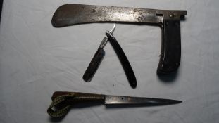 Folding machete, the blade marked indistinctly, but possibly 'Cattaraugul', together with 'The