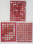 Three trays of coins housed in 'Lindner' trays various world coins including some silver,