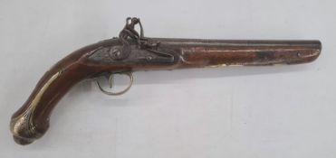 18th century flintlock pistol with circular barrel, engraved lockplate, brass and white metal walnut