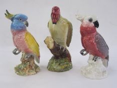 Three Beswick models viz:- no.1218 woodpecker, no.1180 cockatoo in shades of pink and white and no.