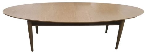 Modern IKEA Stockholm oval coffee table in oak finish, on four turned supports