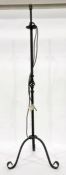 Wrought iron standard lamp on three legs