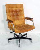 Office swivel chair in tan leather button back upholstery, chrome swivel base