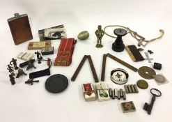 Two antique brass-bound wood folding rulers, small brass figure of John Bull, other miniature