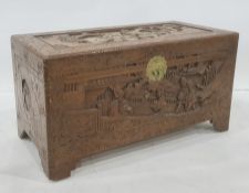20th century carved Chinese camphorwood lined coffer with various figures amongst pagodas to the