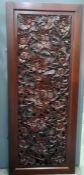 Modern eastern carved stained wood panel featuring birds amongst foliage, 61cm x 153cm