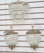 Cut glass three-tier wall light bracket, demi-lune-shaped and graduating, with cut prismatic