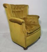 Late 19th/early 20th century armchair in pale green upholstery, on squat bun feet