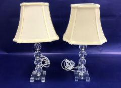 Pair cut glass and chrome table lamps, each with four faceted knops to the column, on square