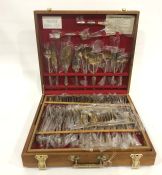 Extensive Eastern brass service of table flatware in teak-effect case