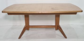 20th century Gordon Russell extending dining table on twin pedestal base united by stretcher