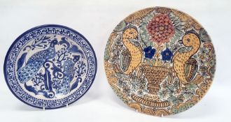 Continental tin glazed earthenware shallow bowl with underglaze blue decoration of exotic birds,